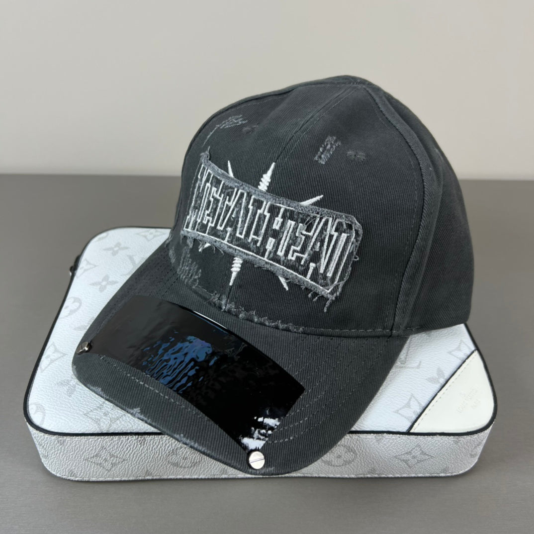 Washed black metal patch cap with glossy shield brim